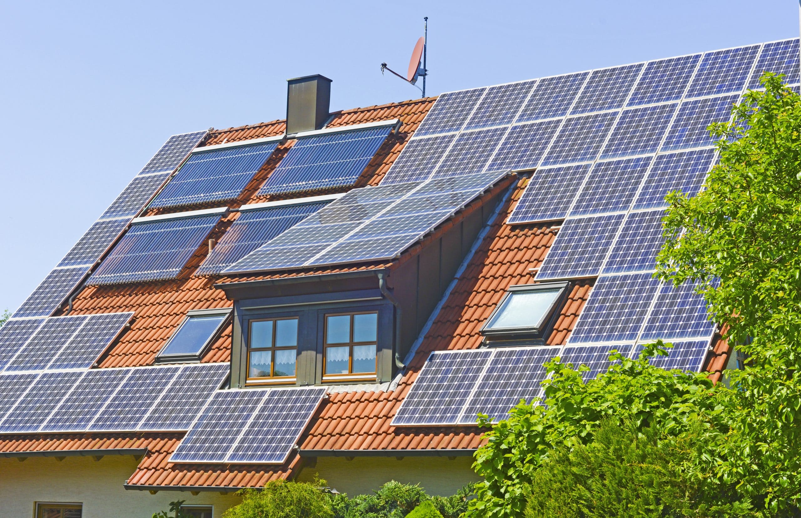 house with many solar panels on the roof