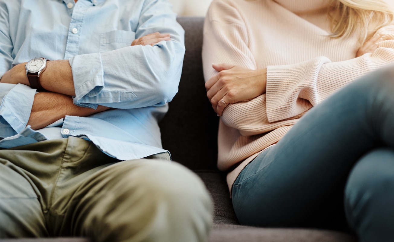 Cropped shot of a couple having a disagreement at home