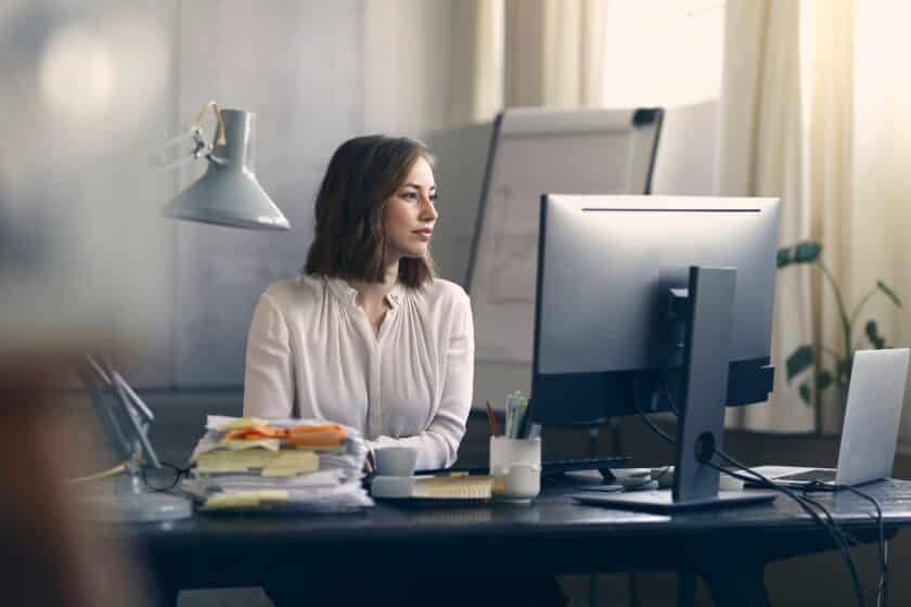 professional female entrepreneur working on her computer at her